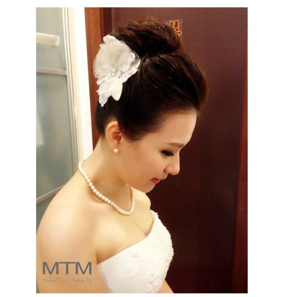 Bridal high bun hairstyle. Makeup